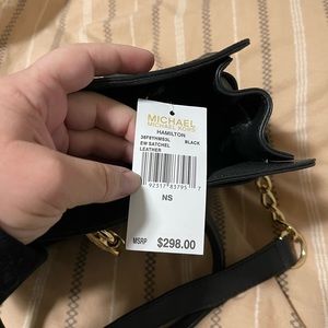 Black Michael Kors Hamilton handbag.